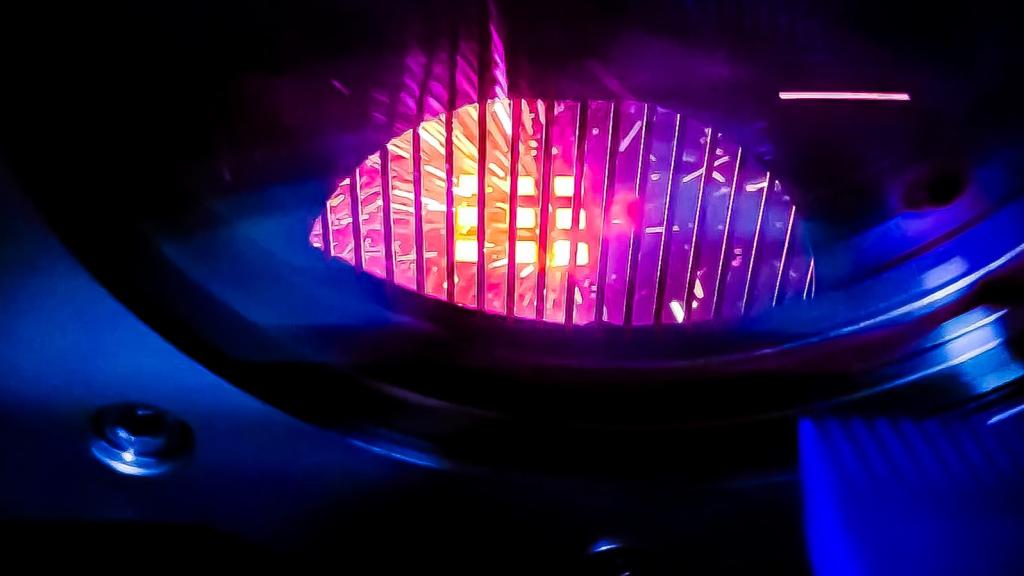 Pictured is a 3D printer that creates objects using electron beam melting, looks like a glowing orb. 